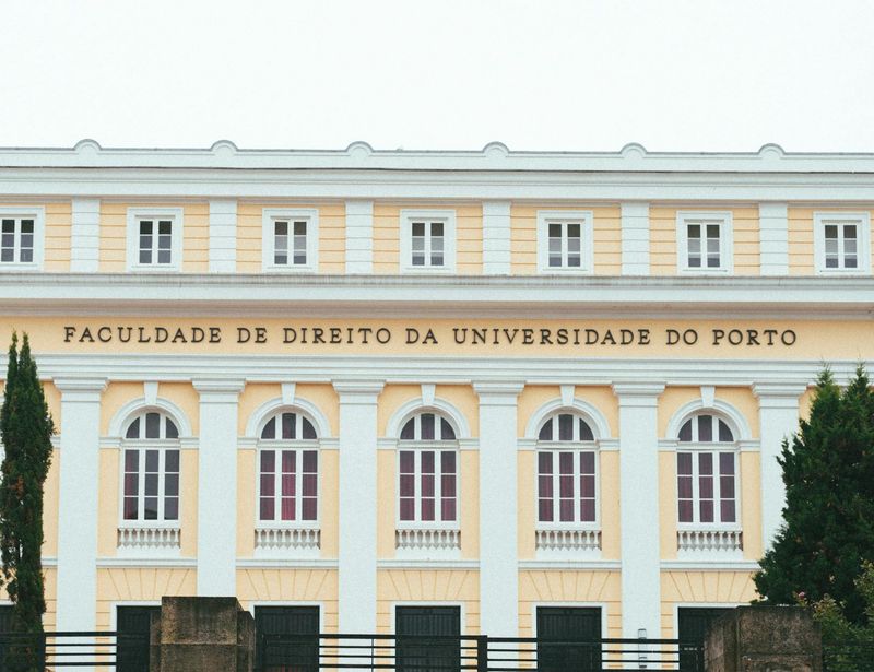 Person doing a tree pose in front of a window.